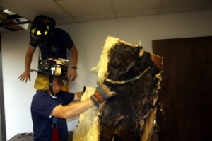 Firefighters Remove Burned Insulation From ORUD