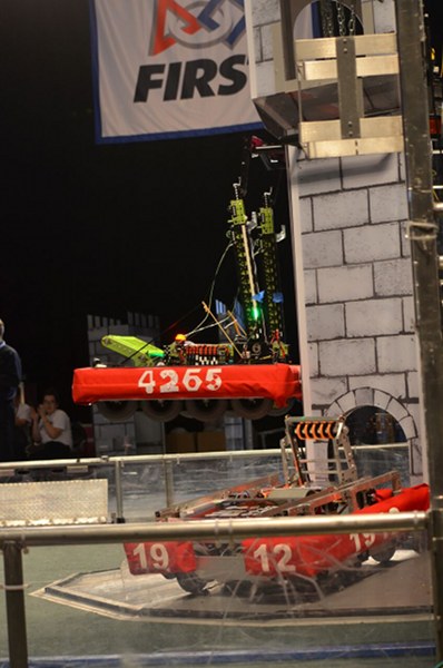 The Secret City Wildbots of Oak Ridge High School are pictured above at the 2016 Smoky Mountain Regionals in Knoxville this week. In Q51, the team continued playing to core strengths but added a feat that only a few robots in this competition have mastered: climbing a tower. (Photo by Angi Agle)