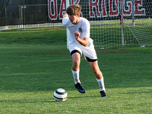 Oak Ridge senior defender Blake Clowers (3) dribbles the ball against Maryville junior goalkeeper Ben Smith during a 4-1 loss for the Wildcats at home on Tuesday, May 3, 2016. (Photo by John Huotari/Oak Ridge Today)