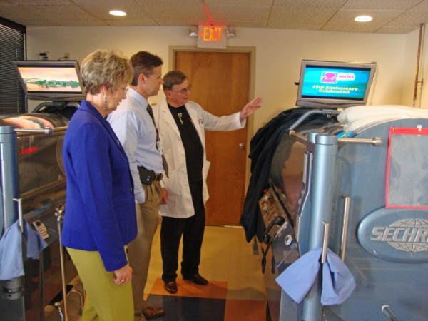 On June 8, the Methodist Wound Treatment Center celebrated its 10-year anniversary and Wound Care Awareness Week during an open house celebration and education event. Guests had a chance to meet the staff, tour the Center, enjoy refreshments, and learn more about the services and specialized products used for treatment. Above, Dr. David Stanley shows the HBO Chamber. (Submitted photo)