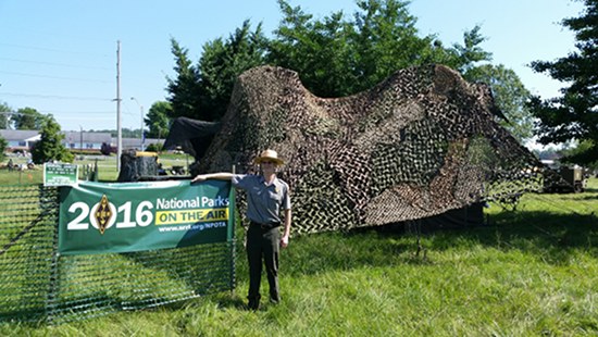 National Park Service Ranger Robbie Meyers outside the Amateur and Military Radios Living Exhibit at the Secret City Festival. The special event was part of National Parks on the Air program. (Submitted photo)