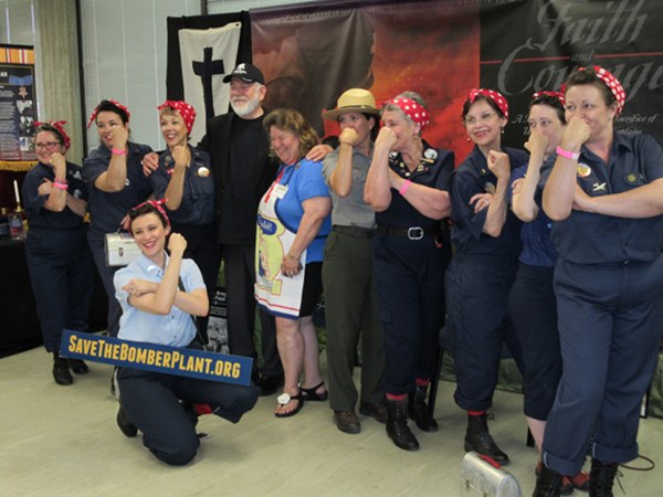 Eight of the 13 Rosie the Riveters are shown here along with Heritage Exhibit participant Tom Walker, Oak Ridge Heritage Room organizer Bobbie Martin, and Interpretive National Park Ranger Veronica Greear. The Rosies are, from left to right, Bette Kenward, Barb Matthews, Vikki Toth, Chris Brown, Patsy Kemner, Kate Weise, Susie Sweeney, and Alison Beatty (down front).Â (Photo by M. McBride)