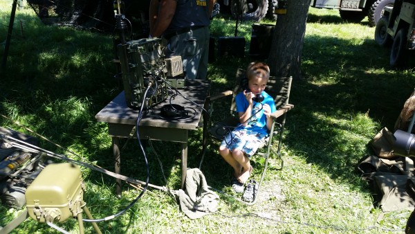 A young operator tries his hand at WWII military-style communications during the Amateur and Military Radios Living Exhibit at the Secret City Festival. (Submitted photo)