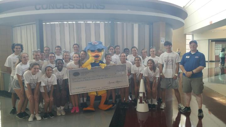 The Oak Ridge cheerleaders recently posed with management representatives and "Lucky" from the Time to Shine Car Wash of Oak Ridge for a check presentation in the amount of $5,361.26 following a very successful fundraising event. (Submitted photo)