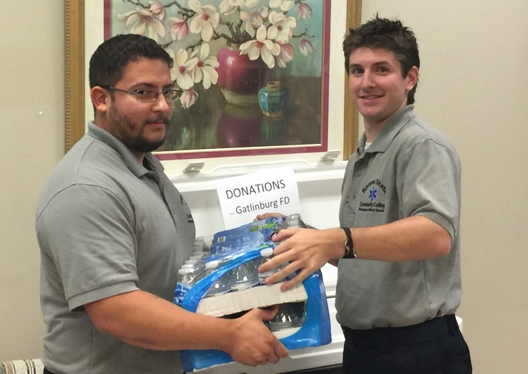 Students Ruben Sotomayor, left, and Cameron Driskill gather supplies at Roane State’s Knox County Center for Health Sciences that will assist emergency responders working the Sevier County wildfires. (Photo by Roane State)