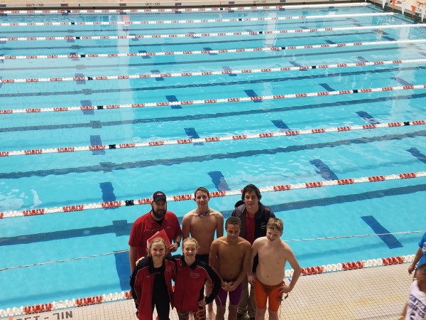 Atomic City Aquatic Club coaches pose with young swimmers. (Submitted photo)