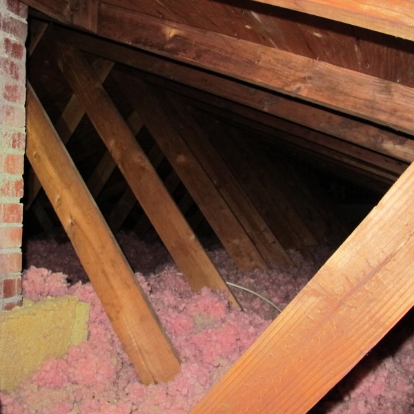 Before and after photos of Lacey’s attic insulation.