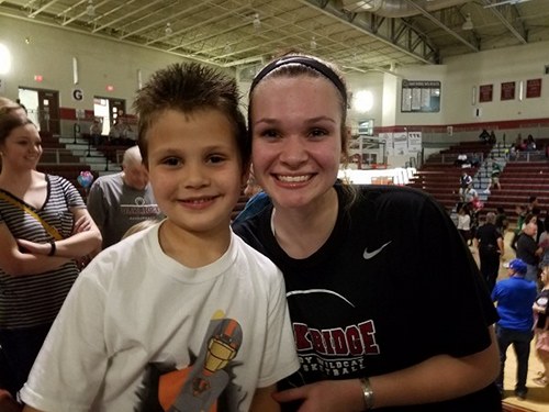 AJ Cucksey meets Oak Ridge Lady Wildcats junior Destiny Kassner during a Region 2-AAA quarterfinal game at Wildcat Arena in February 2017. (Photo courtesy Prayers for AJ)