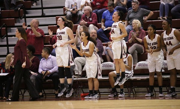 The Oak Ridge Lady Wildcats celebrate late in the fourth quarter of a 62-56 win over Bearden in a Region 2-AAA quarterfinal elimination game at Wildcat Arena on Friday, Feb. 24, 2017. (Photo by Luther Simmons)