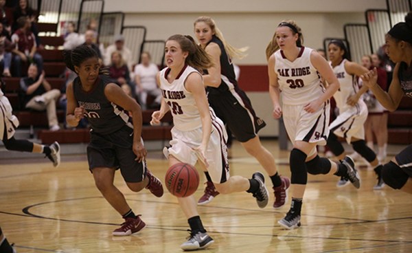 Oak Ridge senior Courtney Ellison (10) dribbles the ball in transition during a 62-56 win over Bearden in a Region 2-AAA quarterfinal elimination game at Wildcat Arena on Friday, Feb. 24, 2017. Also pictured are Bearden junior Grace van Rij (44) and freshman Keke McLaughlin (20), and Oak Ridge junior Destiny Kassner (30). (Photo by Luther Simmons)