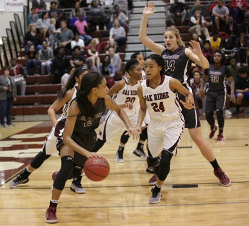 Pictured above are the top two scorers in the Region 2-AAA quarterfinal elimination game at Wildcat Arena on Friday, Feb. 24, 2017. Oak Ridge sophomore Jada Guinn (24) scored a game high and career high 32 points for the Lady Wildcats in a 62-56 win over Bearden, and Lady Bulldogs junior Trinity Lee (2) scored 25. (Photo by Luther Simmons)