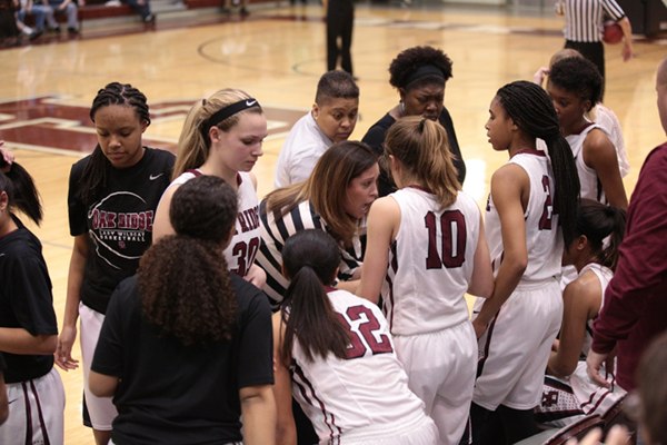 The Oak Ridge Lady Wildcats huddle with Coach Paige Redman during a 48-47 Region 2-AAA semifinal win over William Blount at Wildcat Arena on Monday, Feb. 27, 2017. (Photo by Luther Simmons)