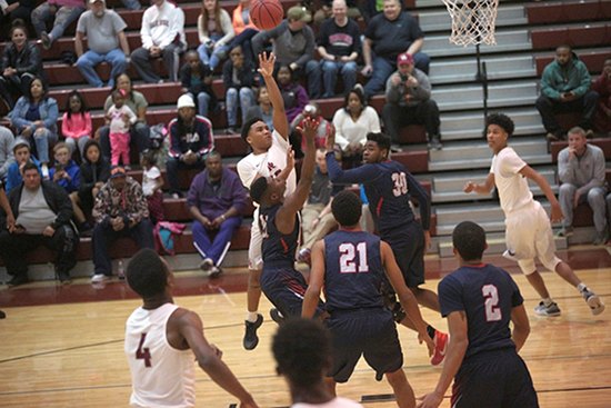 Oak Ridge junior point guard Levert Smith (10) shoots the basketball during a 68-38 Region 2-AAA quarterfinal win against West at Wildcat Arena on Saturday, Feb. 25, 2017. (Photo by Luther Simmons)