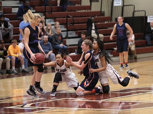 Oak Ridge and William Blount battle for a loose ball at mid-court during a 48-47 Region 2-AAA semifinal win over William Blount at Wildcat Arena on Monday, Feb. 27, 2017. (Photo by Luther Simmons)