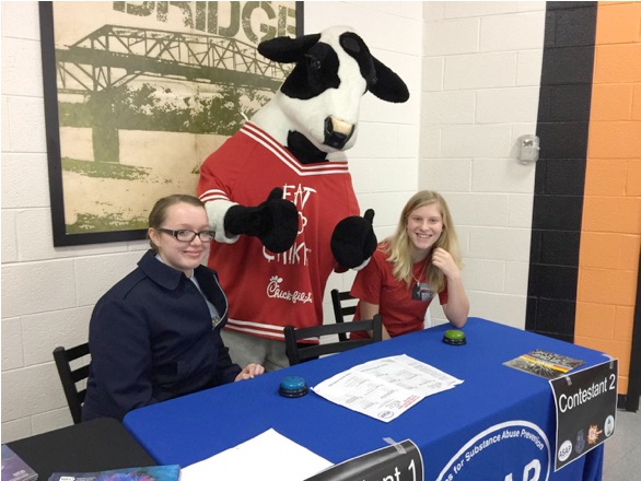 Victoria Seiber, the Chick-fil-A Cow, and Alexis Roy at Clinton High School for the ASAP Ambassadorâ€™s National Drug and Alcohol IQ Challenge. (Photo by Allies for Substance Abuse Prevention of Anderson County)