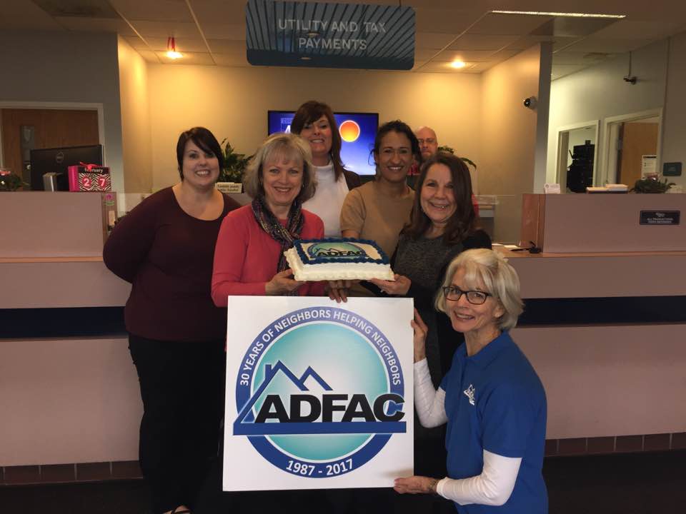 ADFAC Board Member Cande Seay, front right, presenting a 30th birthday cake to Oak Ridge Electric Department staff members, including, from left to right, Amy Justice, Tina Ferguson, Tammy Manis, Gabby Ollis, Andrew Lape, and Marlene Bannon. (Submitted photo0