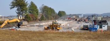 Workers reduce the size and transport debris from Building K-731’s demolition at East Tennessee Technology Park, the former K-25 site in west Oak Ridge. (Photo by DOE)