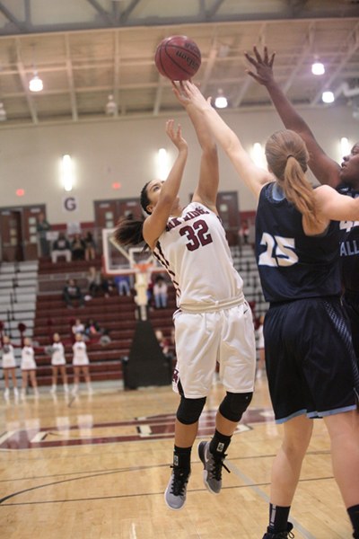 Oak Ridge junior Jaymi Golden (32) shoots against Hardin Valley junior Abbey Cornelius (25) and senior Symphony Buxton during a 71-42 win for the Lady Wildcats in the Region 2-AAA championship at Wildcat Arena on Wednesday, March 1, 2017. (Photo by Luther Simmons)
