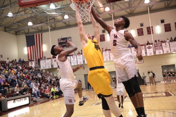 Oak Ridge senior Tee Higgins (5) goes for a block against Paul Arrowood (44) of David Crockett during a 90-60 win for the Wildcats in a sectional at Wildcat Arena on Monday, March 6, 2017. Also pictured is Oak Ridge senior Tyshawn Young (4). (Photo by Luther Simmons)