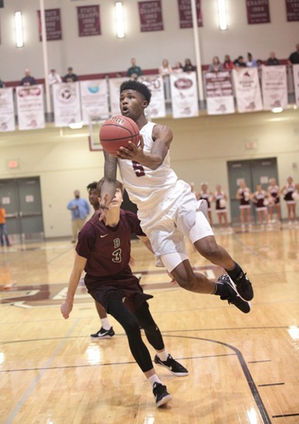 Oak Ridge senior Tee Higgins (5) drives to the basket against Bearden during an 86-73 win for the Wildcats in the Region 2-AAA basketball championship at Wildcat Arena on Thursday, March 2, 2017. (Photo by Luther Simmons)