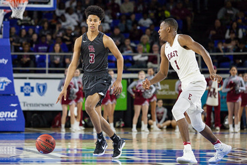 Oak Ridge senior Tajion Jones (3) dribbles around Memphis East junior T.J. Moss (1) during a 63-60 loss for the Wildcats in a Class AAA boys' state semifinal game at Murphy Center in Murfreesboro on Friday, March 17, 2017. (Photo by Kindell Moore)