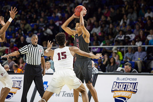Oak Ridge senior Tajion Jones (3) looks for a pass against Memphis East senior Jayden Hardaway (15) during a 63-60 loss for the Wildcats in a Class AAA boys' state semifinal game at Murphy Center in Murfreesboro on Friday, March 17, 2017. (Photo by Kindell Moore)