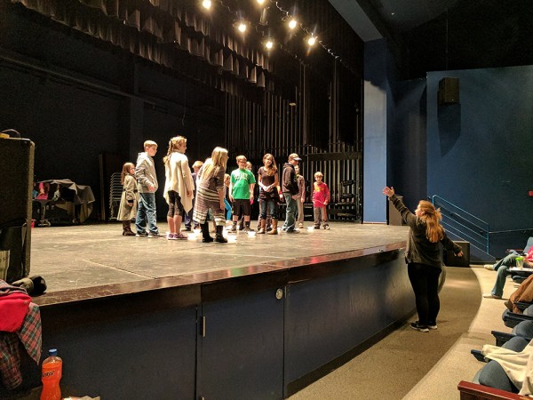 During a rehearsal, Sophie King of Arts in Motion teaches the children who play orphans the choreography for "Food Glorious Food." (Photo by Roane State)