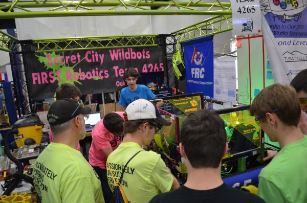 The Secret City Wildbots Team 4265 pit crew makes adjustments between qualification rounds at the First Robotics Palmetto Regional in Myrtle Beach, South Carolina, on Friday, March 3, 2017. (Photo by Angi Agle)