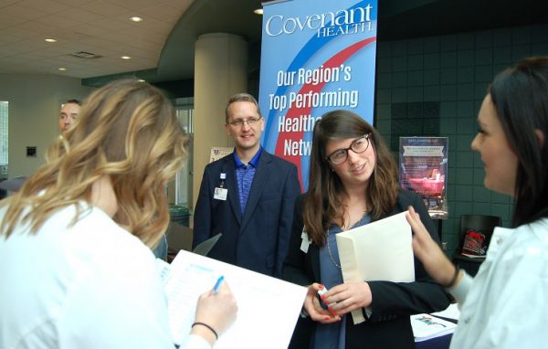 Covenant Health employees Nelson Leiser and Liz Floyd talk with Roane State students on the verge of graduating in healthcare fields during the annual Healthcare Job Fair, held March 29 at the collegeâ€™s Oak Ridge campus. (Photo by Roane State)