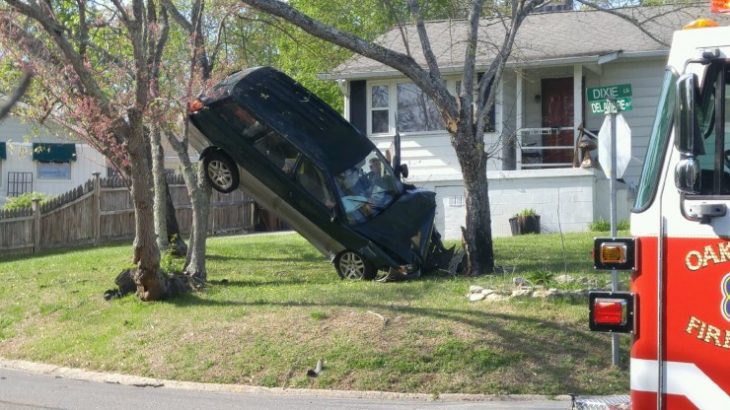A Subaru Outback station wagon went off Delaware Avenue and appeared to have crashed into trees while airborne at a house at Dixie Lane on Thursday evening, April 13, 2017. (Photo by Mark Boatner)