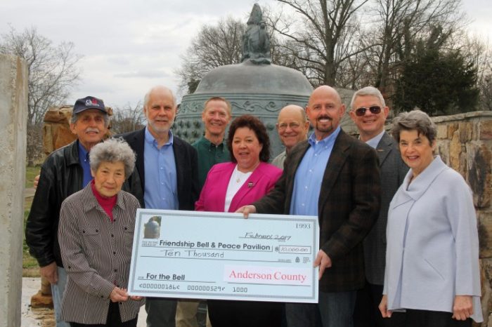 Anderson County Commissioners present a $10,000 check for the new Peace Pavilion to house the International Friendship Bell to Shigeko Uppuluri, left, and Pat Postma, right. Commissioners are Theresa Scott and Steve Emert, Commission chair, front; and in back from left, Jerry Creasey, Myron Iwanski, Phil Yager, Whitey Hitchcock, and Steve Mead. (Submitted photo)