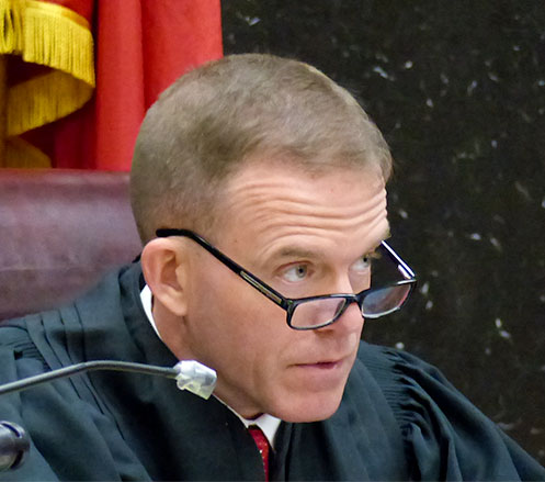 Judge John D. McAfee of Tazewell has been appointed to hear the civil lawsuits filed against Lee Harold Cromwell, 68, of Oak Ridge, after a fatal crash in a parking lot at Midtown Community Center on July 4, 2015. Anderson County Circuit Court Judge Donald R. Elledge rescued himself after Cromwell filed a lien against him. McAfee is pictured above in Anderson County Circuit Court on Wednesday, April 12, 2017, during a hearing on personal injury and wrongful death lawsuits filed against Cromwell. (Photo by John Huotari/Oak Ridge Today)