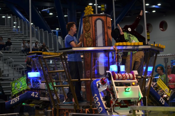 The Secret City Wildbots Team 4265's pilot, Mack Patrick, takes a bow in the airship following a decisive 307-195 win in the first qualifying match of the day in the First Robotics Championship in Houston on Thursday, April 20, 2017. The drive team is visible at lower right. (Photo by Angi Agle)