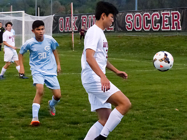 Masa Kato (5) of Oak Ridge controls the soccer ball during a 5-0 win for the Wildcats at the Oak Ridge Soccer Complex on Tuesday, April 4, 2017. Also pictured is Erick DeLaRosa of Gibbs (20). (Photo by John Huotari/Oak Ridge Today)
