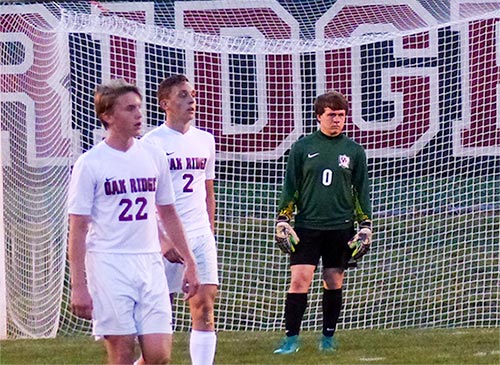 Oak Ridge junior goalkeeper Austyn Lincoln (0) is pictured above during a 6-0 win over Powell at the Oak Ridge Soccer Complex on Tuesday, April 11, 2017. At left are sophomore defender Will Dallas (22) and senior defender Stefan Mortl (2). (Photo by John Huotari/Oak Ridge Today)