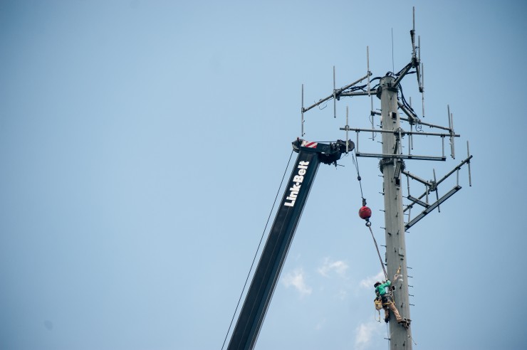 Work on a cell phone tower near Willow Brook Elementary School on Tuesday, May 9, 2017. (Photo by Julio Culiat)