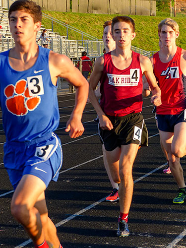 Oak Ridge senior Jake Etheridge, center, qualified for three events, including the boys 3,200-meter run, at the 2017 TSSAA State Track Meet during the Class AAA Section 1 Finals at Hardin Valley Academy on Saturday, May 13, 2017. Etheridge also qualified in the 1,600-meter run, and he is a member of the qualifying 4x800-meter relay team. (Photo by John Huotari/Oak Ridge Today)