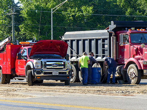 South Illinois Avenue remained closed early Friday afternoon, May 26, 2017, after about 100 gallons of diesel fuel spilled onto the road following a crash involving a dump truck and two vehicles at Lafayette Drive/Scarboro Road in south Oak Ridge. (Photo by John Huotari/Oak Ridge Today)