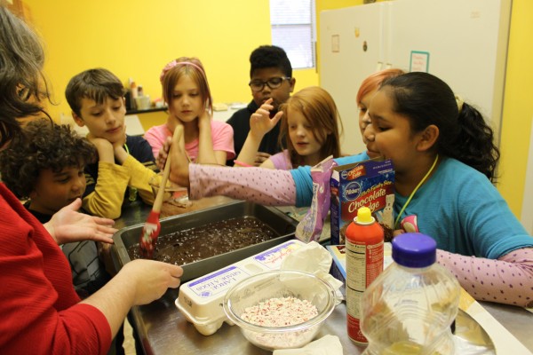 Young cooks prepare dessert for tasting later at a Childrenâ€™s Museum summer camp. (Submitted photo)