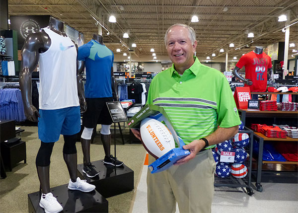 Dick's Sporting Goods is now open at Main Street Oak Ridge, and the new store had a ribbon-cutting ceremony on Tuesday, June 27, 2017. Pictured above is Oak Ridge Board of Education Vice Chair Bob Eby, who bought the first product from Dick's Sporting Goods. (Photo by John Huotari/Oak Ridge Today)