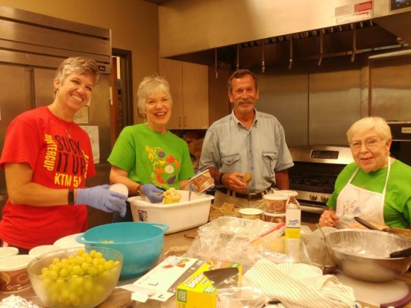 Volunteers at Oak Ridge Unitarian Universalist Church prepare home cooked meals at the monthly Stone Soup Ministry Free Community Meal. (Submitted photo)