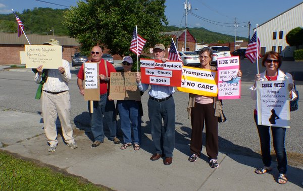 Protesters express their opposition to the health care vote in May by U.S. Representative Chuck Fleischmann, a Tennessee Republican, during a ribbon-cutting ceremony at the Rocky Top post office on May 9, 2017. (Photo by John Huotari/Oak Ridge Today)