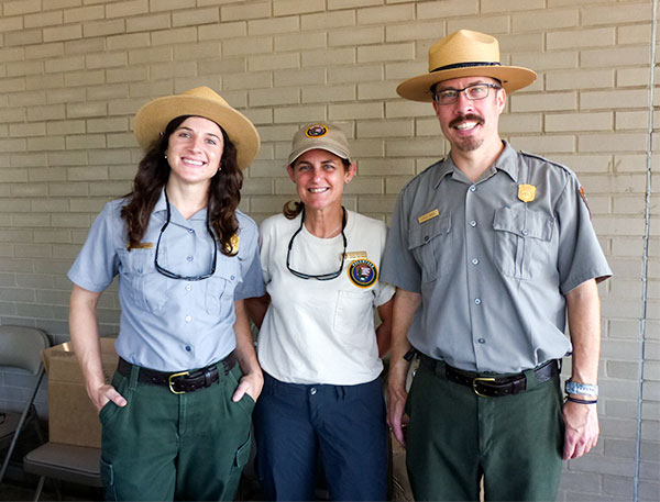 Pictured above at the American Museum of Science and Energy before the total solar eclipse on Monday, Aug. 21, 2017, are Daniel Banks, right, National Park Service education specialist for Big South Fork National River and Recreation Area and Obed Wild and Scenic River; Nita Tallent, center, chief of natural resources and science at Cape Cod National Seashore; and Kendra Owenby, cultural resources program manager for the Manhattan Project National Historical Park, Big South Fork River and Recreational Area, and Obed Wild and Scenic River. (Photo by John Huotari/Oak Ridge Today)