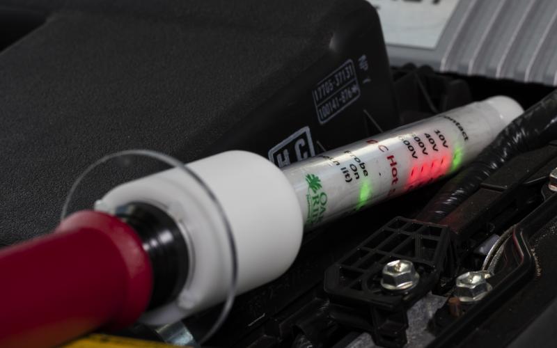 The DC Hot Stick voltage probe can accurately detect the presence of DC voltages within a hybrid electric vehicle. (Photo: Carlos Jones, ORNL)