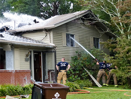A woman escaped and pets were evacuated after lightning struck a home on Albion Road in east Oak Ridge on Tuesday morning, Sept. 5, 2017, likely destroying the residence, authorities said. The Oak Ridge Fire Department continues to cool hot spots above. (Photo by John Huotari/Oak Ridge Today)