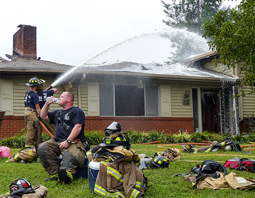 A woman escaped and pets were evacuated after lightning struck a home on Albion Road in east Oak Ridge on Tuesday morning, Sept. 5, 2017, likely destroying the residence, authorities said. The Oak Ridge Fire Department continues to cool hot spots above. (Photo by John Huotari/Oak Ridge Today)