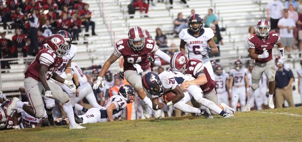 Oak Ridge sophomore linebacker Jacob Adams (44) makes a tackle against West at home on Blankenship Field on Friday, Sept. 15, 2017. Also pictured is senior lineman Adarius Cox (84). (Photo by Luther Simmons)