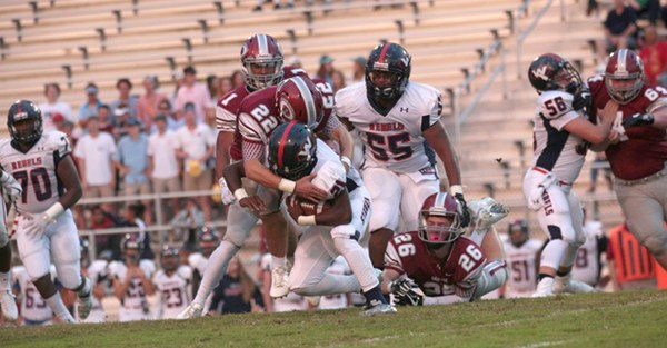 Oak Ridge senior linebacker Cobe Angel (22) makes a tackle against West at home on Blankenship Field on Friday, Sept. 15, 2017. Also picture is sophomore Jack Replogle (26). (Photo by Luther Simmons)