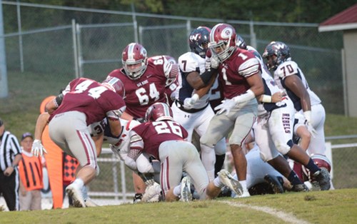 Members of the Oak Ridge defense are pictured above at home against West on Blankenship Field on Friday, Sept. 15, 2017. From left they are sophomore Jacob Adams (44), senior Jack Borchers (64), sophomore Jack Replogle (26), and junior Jeremy Mitchell (1). (Photo by Luther Simmons)