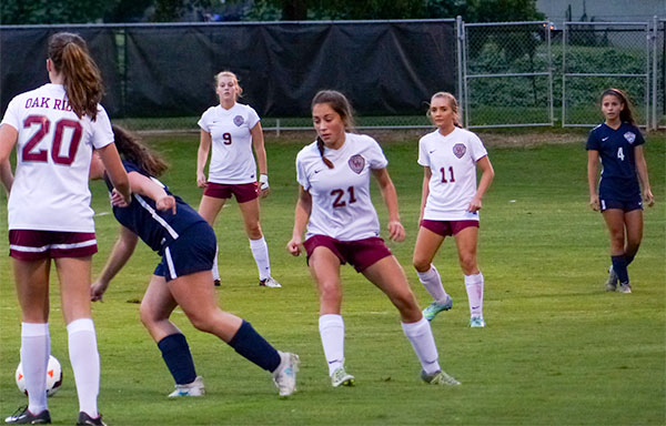 Pictured above on defense during a 2-1 win over West at Oak Ridge High School on Tuesday, Sept. 12, 2017, are, from left, Rachael Brewer (9), Maddie Peters (21), and Alex Rouse (11). (Photo by John Huotari/Oak Ridge Today)